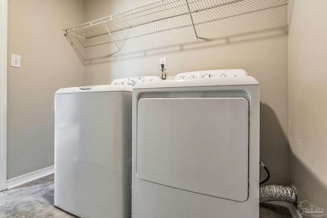 laundry area with independent washer and dryer