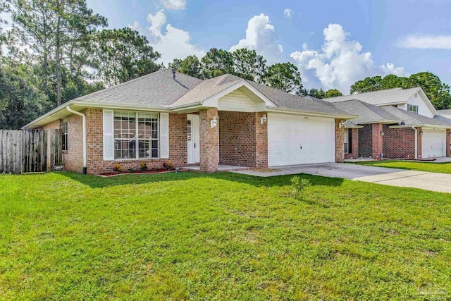 ranch-style home featuring a garage and a front yard