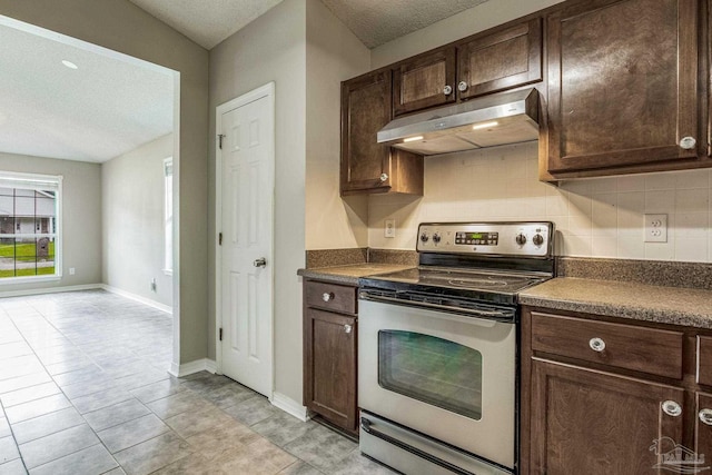 kitchen with dark brown cabinets, decorative backsplash, a textured ceiling, and stainless steel electric range