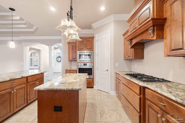 kitchen featuring custom range hood, appliances with stainless steel finishes, ornamental molding, a kitchen island, and light stone countertops