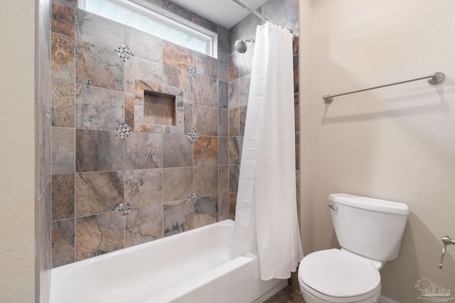 full bathroom with toilet and shower / tub combo