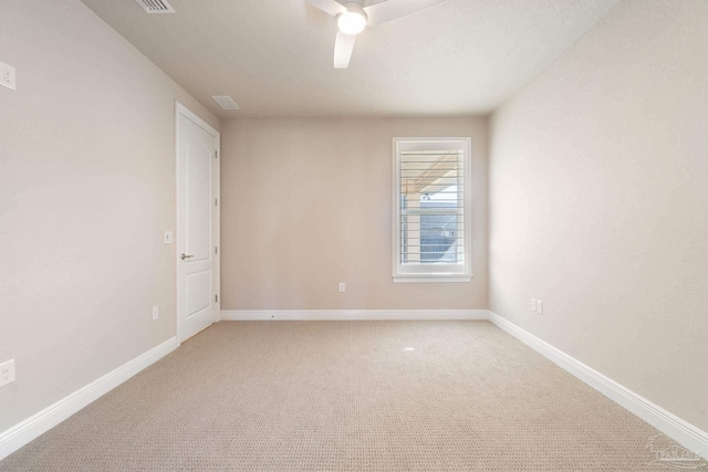 unfurnished room with light carpet, ceiling fan, and baseboards