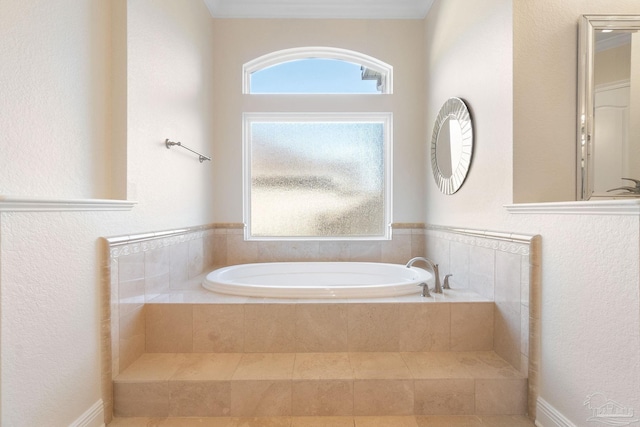 bathroom with a healthy amount of sunlight and a garden tub