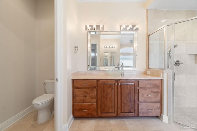 bathroom with toilet, a stall shower, vanity, tile patterned flooring, and baseboards