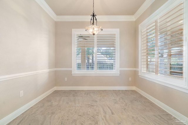 unfurnished dining area with baseboards and crown molding