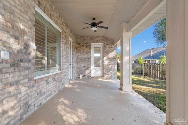 view of patio / terrace with fence and a ceiling fan