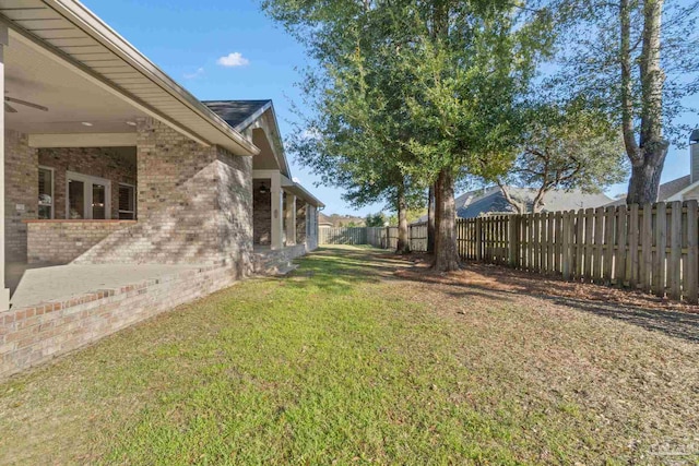 view of yard featuring a patio area and a fenced backyard