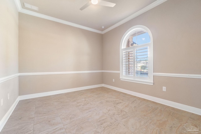 spare room with visible vents, ornamental molding, a ceiling fan, and baseboards