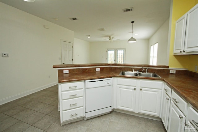 kitchen featuring white dishwasher, sink, light tile patterned flooring, white cabinetry, and ceiling fan