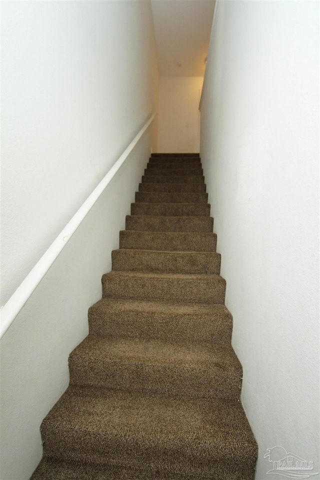 stairs with dark colored carpet