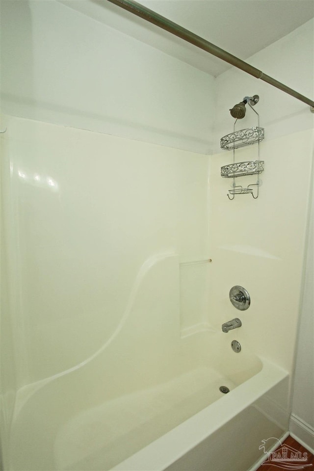 bathroom with shower / bathing tub combination