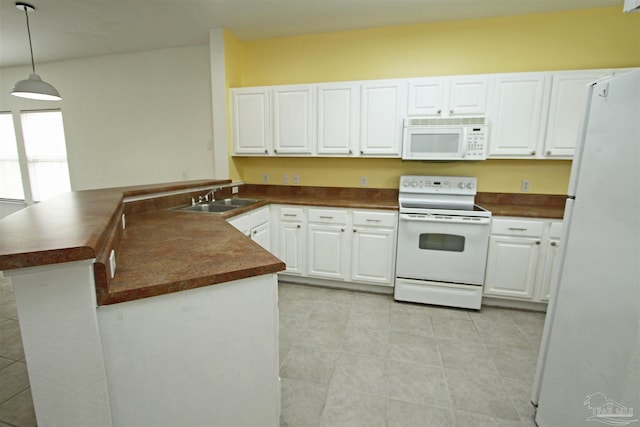 kitchen with sink, light tile patterned floors, pendant lighting, and white appliances