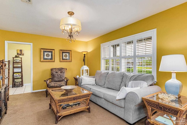 carpeted living room with a chandelier