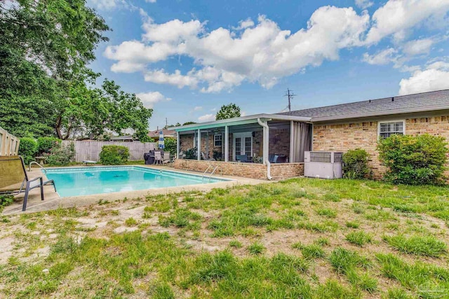 view of pool with a diving board and a patio area