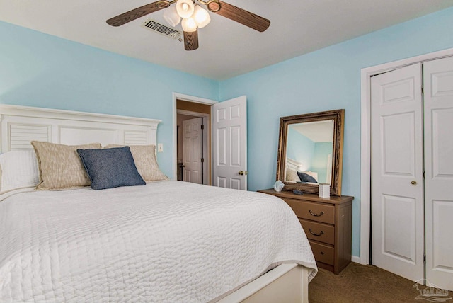 carpeted bedroom with ceiling fan and a closet