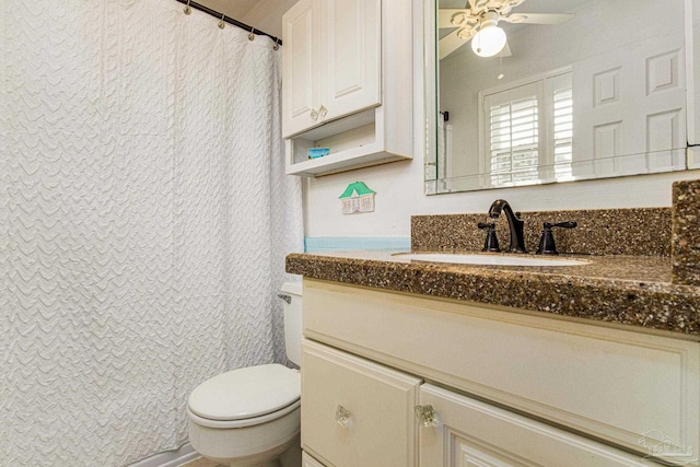 bathroom with ceiling fan, vanity, and toilet