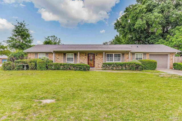 ranch-style house with a front yard and a garage