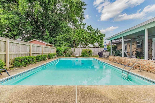 view of pool featuring ceiling fan and a patio