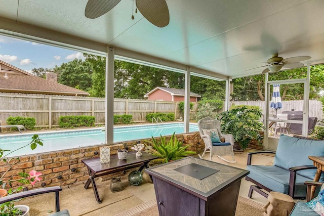 sunroom with ceiling fan and a healthy amount of sunlight