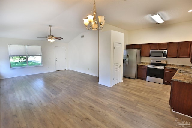2608 Salamanca St, Navarre, FL 32566 - kitchen featuring appliances with stainless steel finishes, ceiling fan, a chandelier, light wood-style flooring, and vaulted ceiling