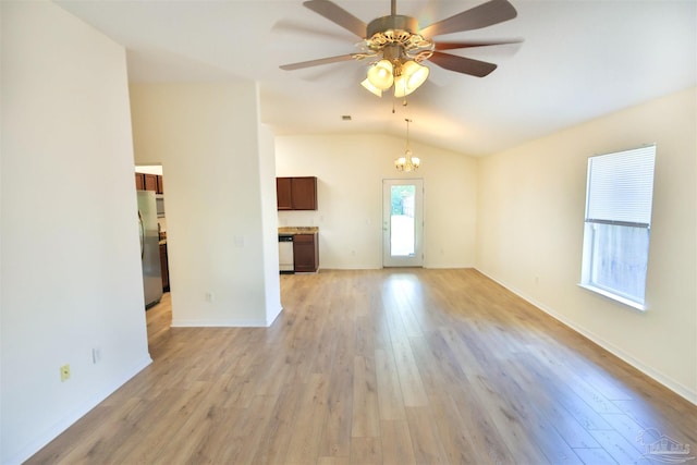 2608 Salamanca St, Navarre, FL 32566 - unfurnished living room with vaulted ceiling, ceiling fan, light wood-style floors, a chandelier, and baseboards