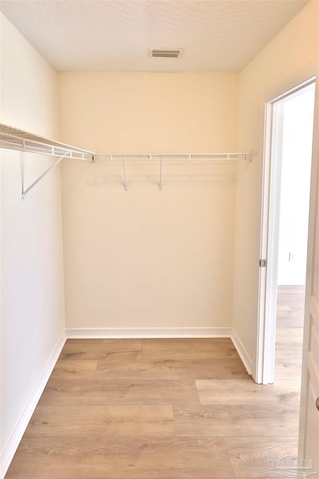 2608 Salamanca St, Navarre, FL 32566 - walk in closet with light wood finished floors