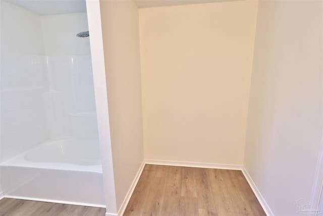 2608 Salamanca St, Navarre, FL 32566 - bathroom with wood finished floors, baseboards, and bathtub / shower combination