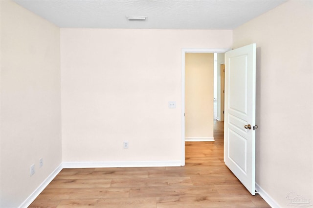2608 Salamanca St, Navarre, FL 32566 - empty room with light wood-style flooring and baseboards