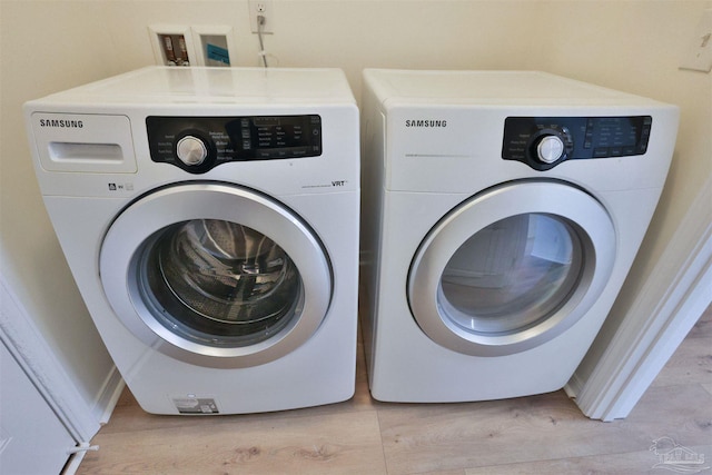 2608 Salamanca St, Navarre, FL 32566 - laundry room with separate washer and dryer and light wood-style floors