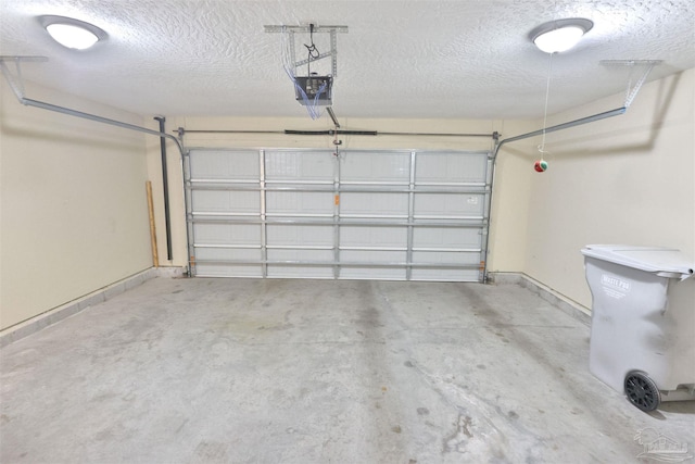 2608 Salamanca St, Navarre, FL 32566 - garage with a garage door opener and baseboards