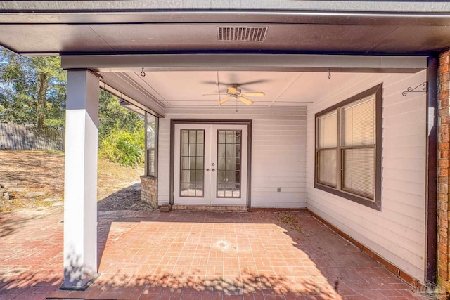 view of exterior entry featuring a patio, french doors, and ceiling fan