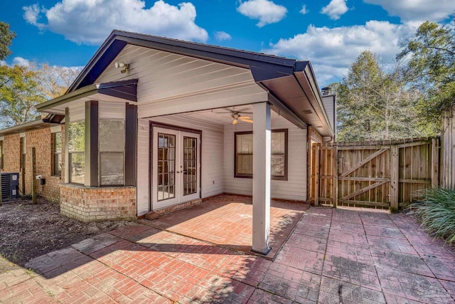 exterior space with ceiling fan, french doors, and central air condition unit