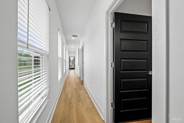 hall with light wood-type flooring