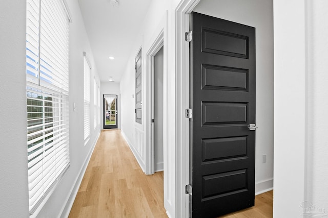 hall with light hardwood / wood-style floors