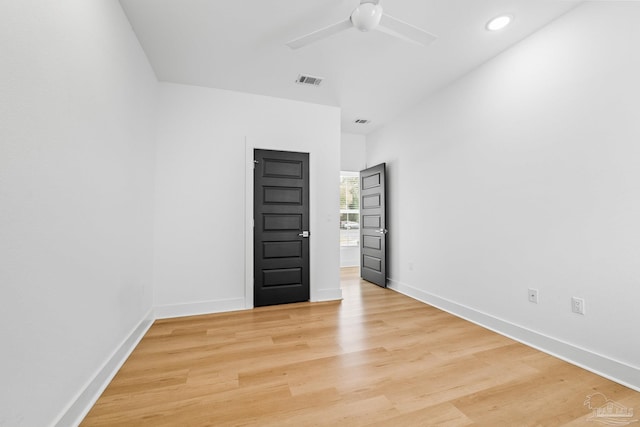 unfurnished room featuring ceiling fan and light wood-type flooring