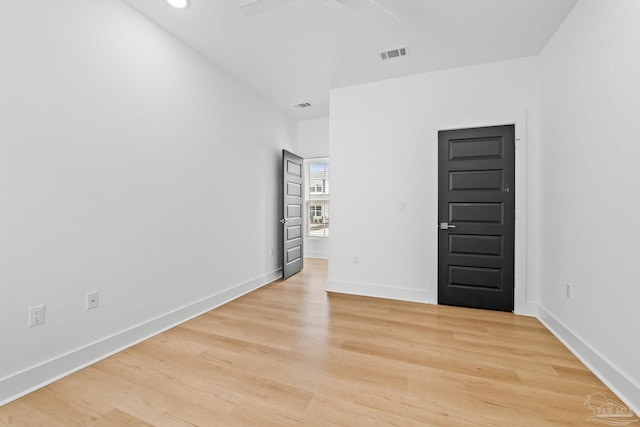 spare room with light wood-type flooring