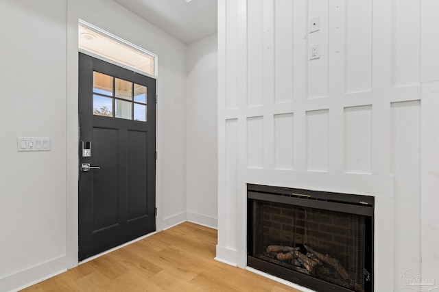 entryway with wood-type flooring