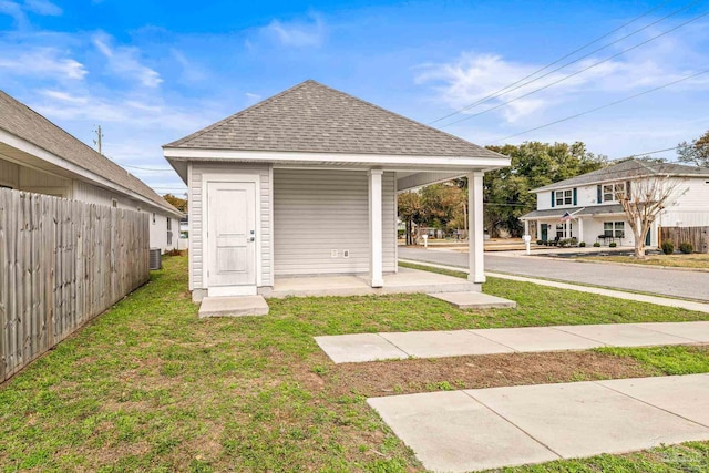 exterior space featuring a yard and central air condition unit