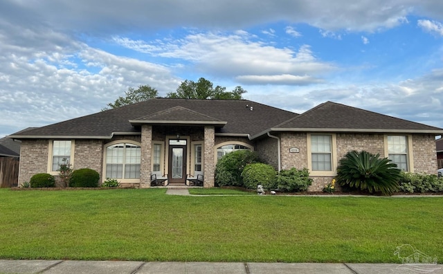 4356 Winners Gait Cir, Pace, FL 32571 - view of front facade with a front lawn, brick siding, and a shingled roof
