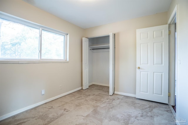 unfurnished bedroom with a closet