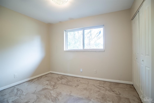 unfurnished bedroom with a closet