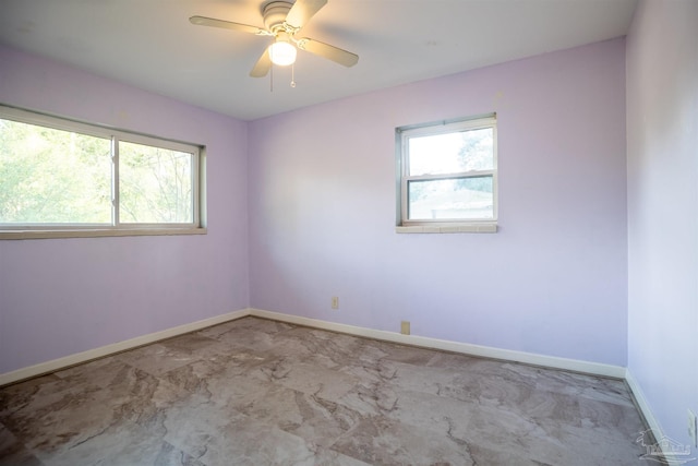 unfurnished room with plenty of natural light and ceiling fan