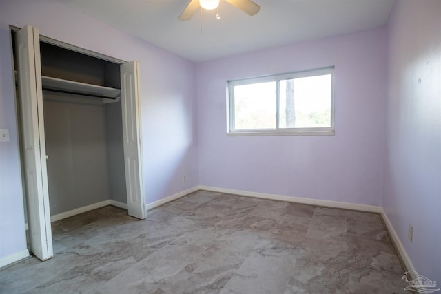 unfurnished bedroom featuring ceiling fan and a closet