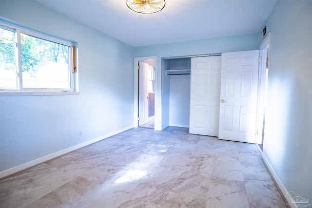 unfurnished bedroom with a closet