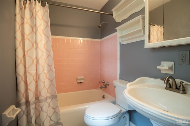 full bathroom featuring toilet, sink, and shower / tub combo