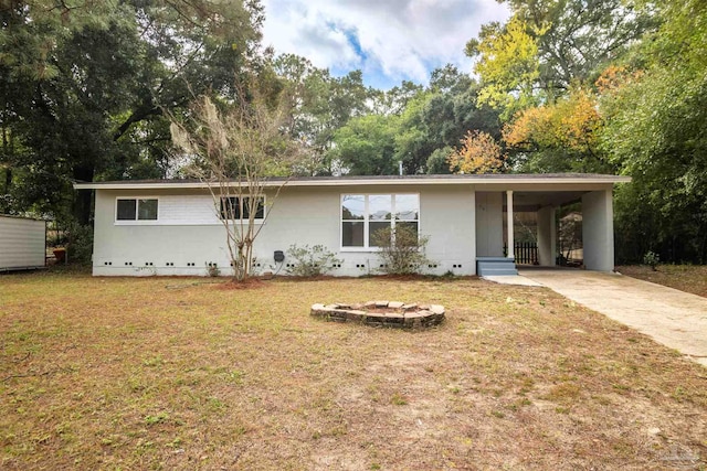 single story home with a front yard and a carport