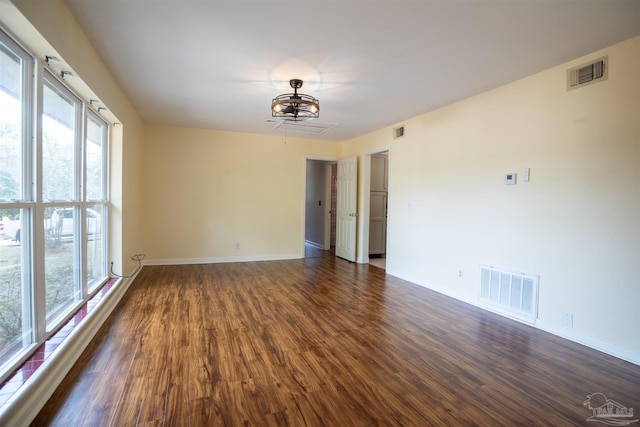 empty room featuring dark wood-type flooring