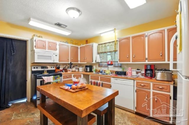 2738 Garcon Point Rd, Milton, FL 32583 - kitchen featuring white appliances, a sink, light countertops, and a textured ceiling