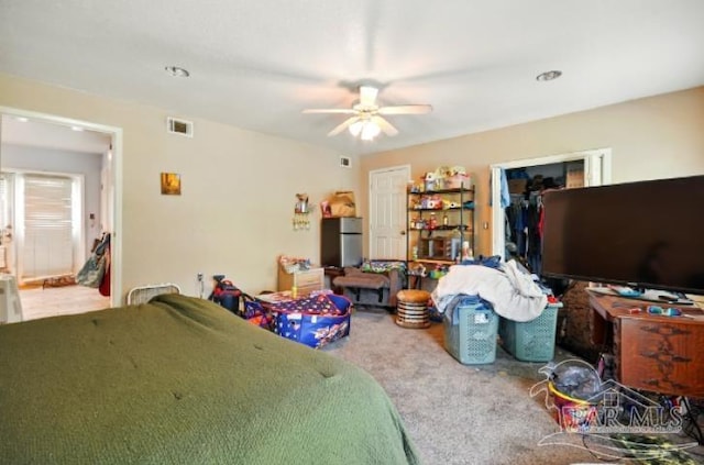 2738 Garcon Point Rd, Milton, FL 32583 - carpeted bedroom with a closet, a ceiling fan, and a spacious closet