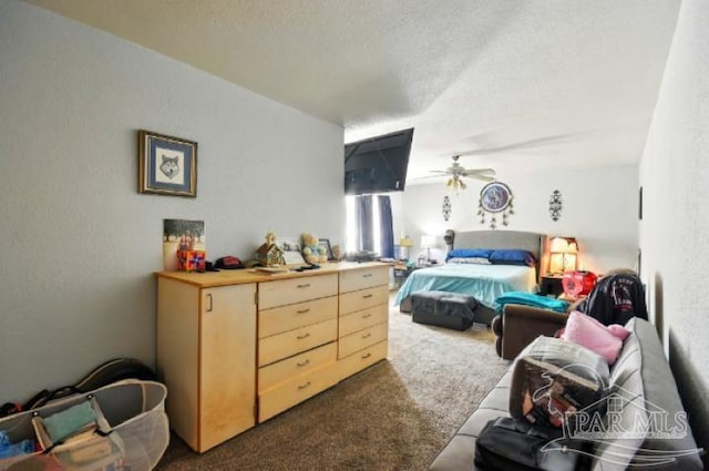 2738 Garcon Point Rd, Milton, FL 32583 - bedroom featuring dark colored carpet, a textured ceiling, and a textured wall